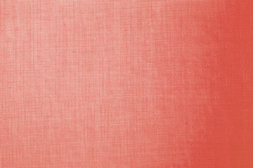 Fototapeta na wymiar abstract background: unique wavy pattern of overlaying two grids, blurred and tinted to the color of the living coral