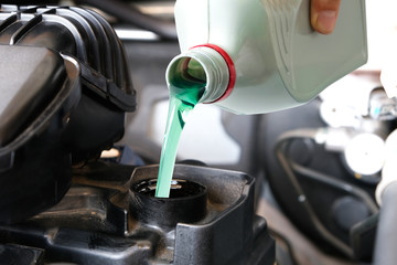 Refueling and pouring oil quality into the engine motor car Transmission and Maintenance Gear...