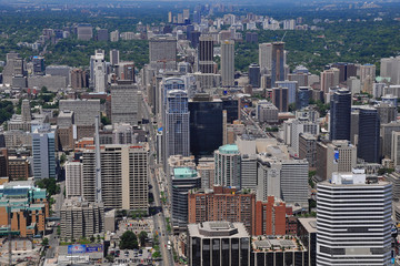 Fototapeta na wymiar Aerial view over the city center of Toronto, Ontario, Canada. Bird-eye view of Toronto from Queen Street looking north.