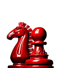 Macro image of a wooden chess pawn and knight in red with white background