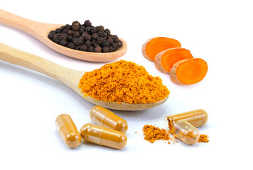 Curcuma capsules, Curcumin powder, Turmeric slices and black peppercorns isolated on white background. Health benefits and antioxidant food concept.