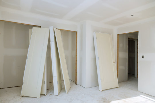 Preparation of interior closet doors for installation in a new home