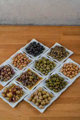 Olives assortment in bowl with oil. 