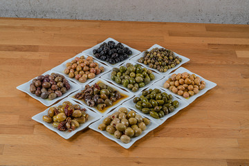 Olives assortment in bowl with oil. 
