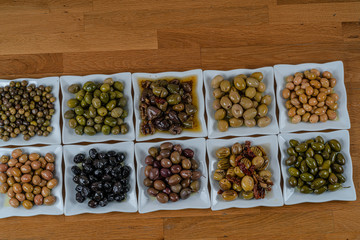 Olives assortment in bowl with oil. 