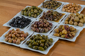 Olives assortment in bowl with oil. 