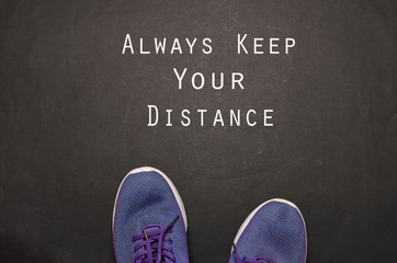 Social distancing concept. Shoes with text Social Distance. This image can be used as social distancing concept to stop the coronavirus from spreading.