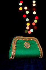 beautiful green purse with bokeh lights
