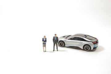 a mini of Business figure and toy car.