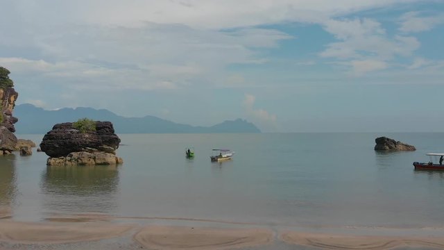 Aerial ascending above a paradise beach at Bako National Park, Kuching, Malaysia