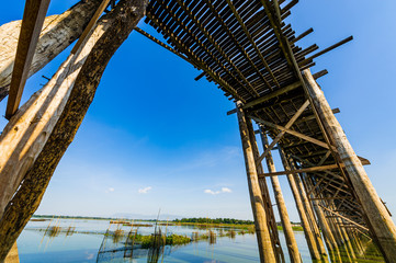 Fototapeta na wymiar Up risen angle view of amazing U Bein bamboo bridge and blue sky , most popular landmark in Amarapura , Myanmar