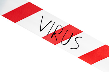 Label virus. Red and white warning tape with the inscription virus close up on an isolated white...