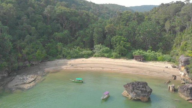 Aerial tilt shot over a paradise beach at Bako National Park, Kuching, Malaysia