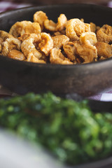 Brazilian pork scratching ( torresmo ) and cabbage ( couve )