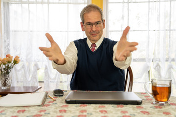 Older middle age businessman reaching out