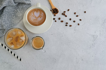 Fototapeta na wymiar iced coffee, latte art hot coffee and espresso shot with bean on marble background .flat lay style.
