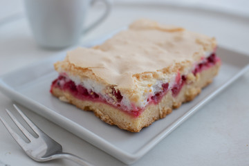 Home made rhubarb meringue cake on a plate