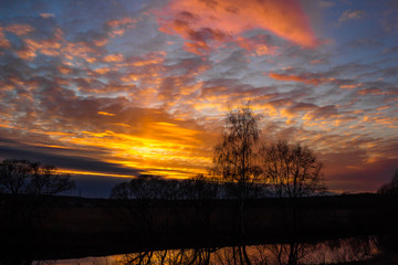 Obraz premium Colorful multicolor sunset over the river 