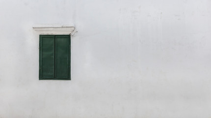 Green old window and white walls with copy space for your text or image.