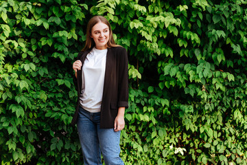 Woman smiling with perfect smile and white teeth in a park