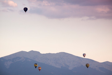 Aerostatic balloon festival over the city of Segovia, Castilla y León. Spain. Adventures with friends and family, flights. Flying at sunrise in a balloon