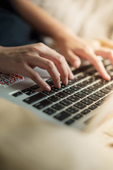 Coronavirus, unrecognized woman typing keyboard on the laptop while working from home  and study online Medium shot