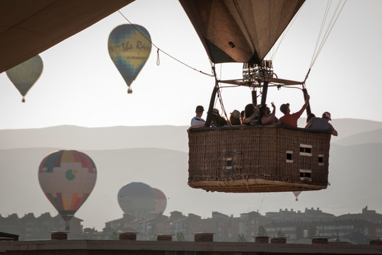 Aerostatic balloon festival over the city of Segovia, Castilla y León. Spain. Adventures with friends and family, flights. Flying at sunrise in a balloon