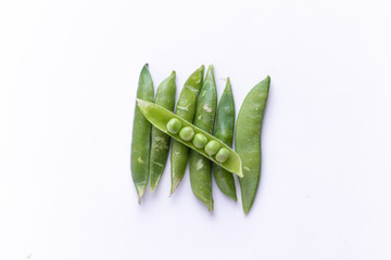 Healthy fresh green peas top view flat lay with white background. 