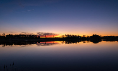 beautiful sunset by the lake, bright colors