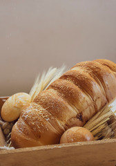 Baked breads on wooden table background.