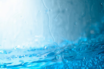 Blue water with shadows from glass