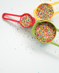 Colourful Sugar sprinkles, decoration for cake, ice-cream and cookies. Top view, Flat lay on white...