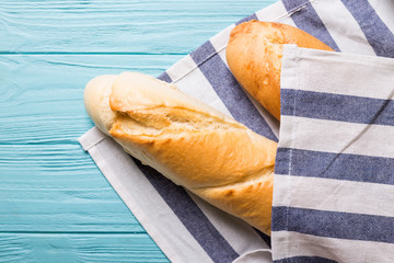 french baguettes  on wooden blue  background