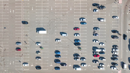 Parking lot with many cars aerial top drone view from above, city transportation and urban concept  © Iuliia Sokolovska