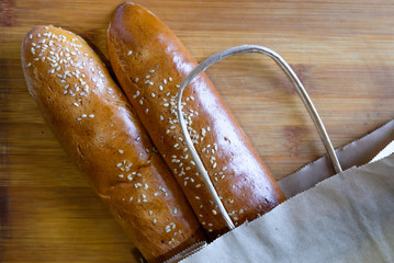 White bread sprinkled with sesame seeds on a wooden Board