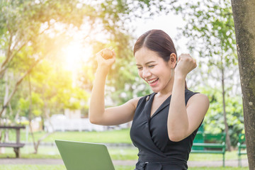 Close up of euphoric young beautiful women celebrating business success reading good news on laptop...