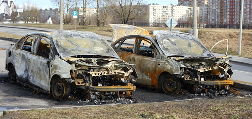 The remains of two burnt-out cars in the Parking lot, Dalnevostochny prospect, Saint Petersburg, Russia, March 2020