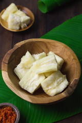 Boiled cassava on rustic bowl. Served with 