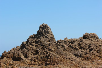 Fototapeta na wymiar 岩と海　山陰ジオパーク　岩美町にて　遊覧船から撮影