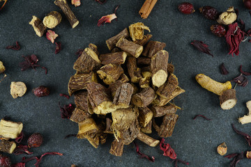 Licorice or liquorice root sticks isolated on dark or textille background stock photo