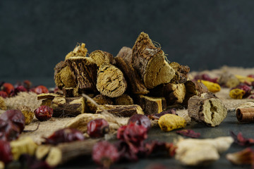 Licorice or liquorice root sticks isolated on dark or textille background stock photo