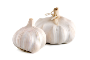 Two fresh garlic heads isolated on white background