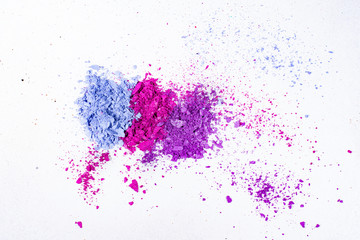 Fototapeta na wymiar Blue Purple and Pink crushed eye shadow isolated on white background.
