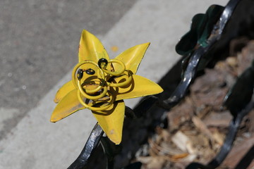 A funny picture on one of the fences in the kindergarten - a forged metal star or flower with...