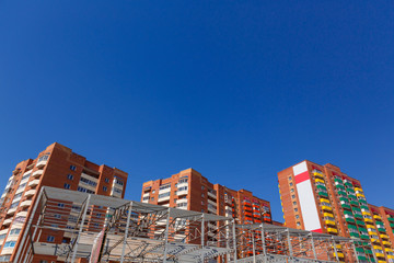 Residential buildings on a background of blue sky
