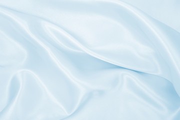 Obraz premium Smooth elegant blue silk or satin luxury cloth texture as abstract background. Luxurious background design