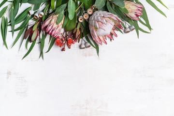Beautiful pink king protea surrounded by  pink ice proteas, leucadendrons, eucalyptus leaves and...