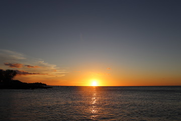 Naklejka na ściany i meble Amazing sunset in Hawaii Big Island with ocean