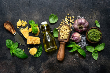 Delicious homemade basil pesto - traditional italian sauce. Top view with copy space.