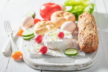 Closeup of preparation for healthy sandwich on white table
